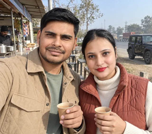 Nav and Vandana with tea at a highway stall, their Thar parked behind them